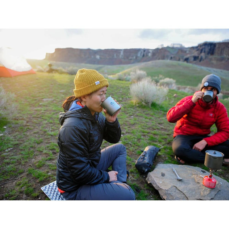 MSR Titan Double Wall Mug in action by the cliffs