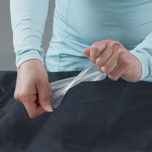 Gear Aid Tenacious Tape Flex Patches demonstrating strength